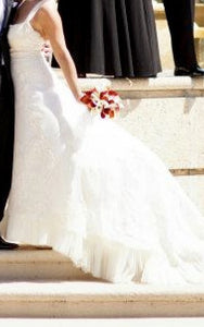 Angel Sanchez 'N821' size 8 used wedding dress side view on bride
