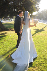 Reem Acra 'Silk Satin' size 4 used wedding dress back view on bride