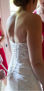 David's Bridal 'A Line' size 2 used wedding dress back view close up on bride