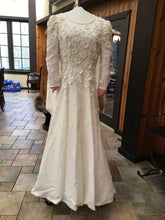 Load image into Gallery viewer, Carolina Herrera &#39;Long Sleeved&#39; size 4 used wedding dress back view on hanger
