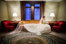 Load image into Gallery viewer, Vera Wang &#39;Off the Shoulder&#39; size 6 used wedding dress side view on bride
