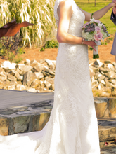 Load image into Gallery viewer, Oleg Cassini &#39;Tank Illusion Back&#39; size 6 used wedding dress side view on bride
