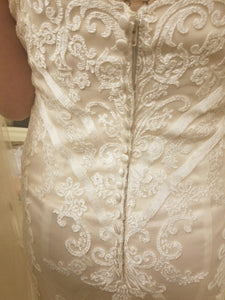 Custom Boutique 'Private Collection' size 8 new wedding dress back view close up on bride