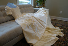 Load image into Gallery viewer, Christos &#39;Lace&#39; size 4 used wedding dress view of couch
