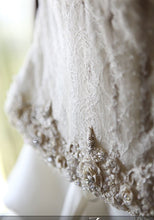 Load image into Gallery viewer, Atelier Aimee &#39;Glamorous&#39; size 6 used wedding dress view of hemline
