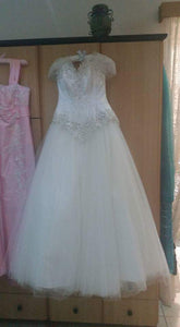 Custom 'Cinderella' size 8 used wedding dress front view on hanger