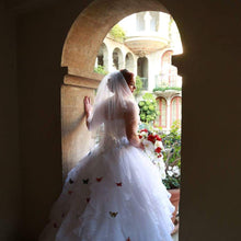 Load image into Gallery viewer, Oleg Cassini &#39;Strapless&#39; size 16 used wedding dress back view on bride
