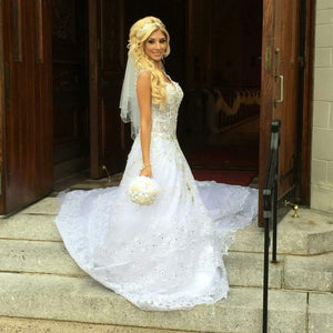 Custom 'Chellen' size 6 used wedding dress side view on bride