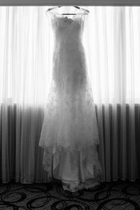 Danielle Caprese '113007' size 6 used wedding dress front view on hanger