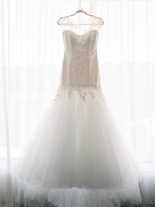 Romona Keveza 'L5100' size 8 used wedding dress front view on hanger
