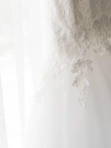 Romona Keveza 'L5100' size 8 used wedding dress back view on hanger