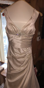 A.C.E. 'Exclusive Bridals' size 6 used wedding dress front view on mannequin