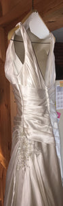 A.C.E. 'Exclusive Bridals' size 6 used wedding dress side view on hanger