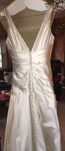 A.C.E. 'Exclusive Bridals' size 6 used wedding dress back view on hanger