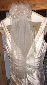 A.C.E. 'Exclusive Bridals' size 6 used wedding dress view of back and veil