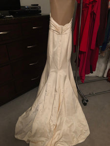 Custom 'Classic/Sexy' size 4 used wedding dress back view on hanger