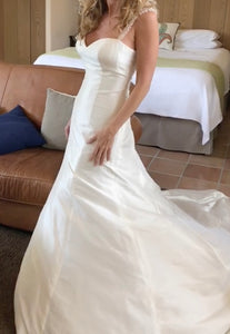 Custom 'Silk' size 4 used wedding dress side view on bride