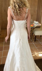 Custom 'Silk' size 4 used wedding dress back view on bride