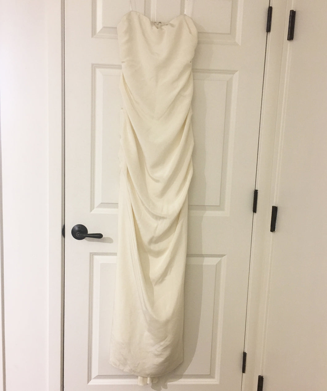 Nicole Miller 'Strapless Ruched' size 12 sample wedding dress front view on hanger