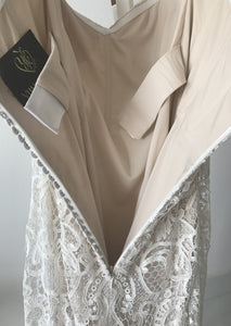 Yumi Katsura 'Camille size 8 sample wedding dress back view on hanger