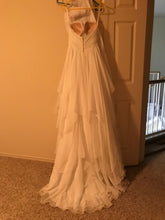 Load image into Gallery viewer, Essence of Australia &#39;1799&#39; size 4 used wedding dress back view on hanger
