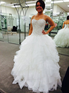 Oleg Cassini 'Strapless Ruffled' size 2 used wedding dress front view on bride