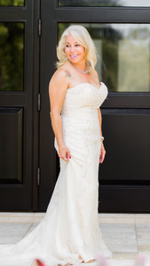 Custom Boutique 'Patricia South' size 6 used wedding dress front view on bride