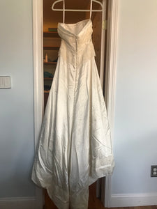 Rivini 'Off White Silk' size 8 used wedding dress back view on hanger