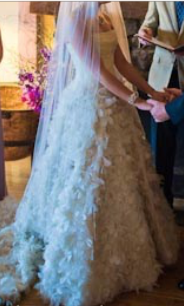 Romona Keveza 'RK138' size 6 used wedding dress side view on bride