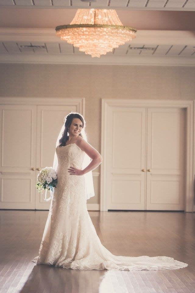 David Tutera 'Strapless' size 12 used wedding dress front view on bride