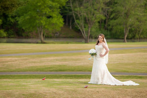 David Tutera 'Strapless' size 12 used wedding dress front view on bride