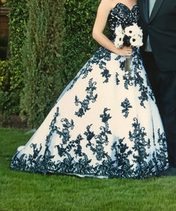 Custom 'White Black' size 0 used wedding dress side view on bride
