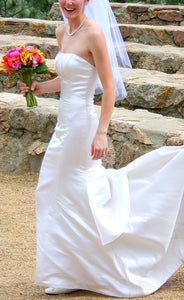 Custom 'Strapless' size 2 used wedding dress side view on bride