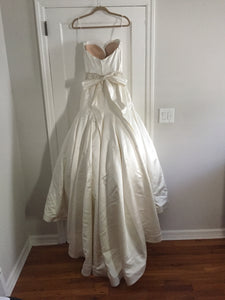 Casablanca '079' size 8 used wedding dress back view on hanger