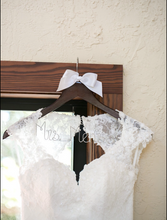 Load image into Gallery viewer, Bonny Bridal &#39;Semi Mermaid&#39; size 6 used wedding dress front view of bodice on hanger
