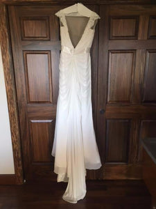 Maggie Sottero 'Crystal Capped Sleeves' size 8 sample wedding dress back view on hanger