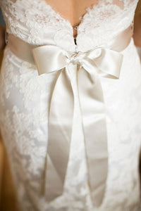 Jim Hjelm '8958' size 14 used wedding dress back view close up on bride
