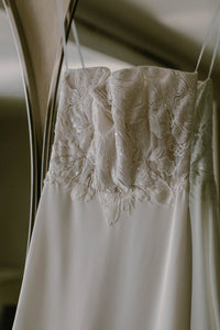 Unbridaled by Dan Jones 'Embroidered Corset Gown' size 8 used wedding dress front view on hanger