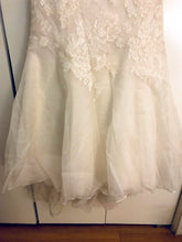 Load image into Gallery viewer, Victoria Nicole &#39;Classic&#39; size 12 used wedding dress view of hemline
