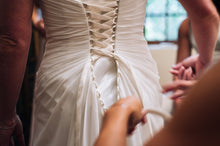 Load image into Gallery viewer, Custom &#39;Corset One Shoulder&#39; size 8 used wedding dress back view on bride
