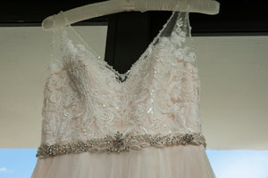 BHLDN 'Cassia' size 0 used wedding dress front view close up on hanger