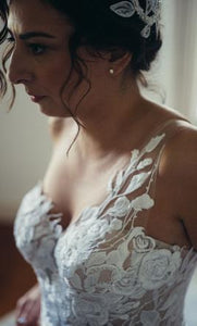Mira Zwillinger 'Rubi' size 6 used wedding dress side view close up on bride