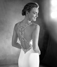 Load image into Gallery viewer, Pronovias &#39;Emmett&#39; size 0 used wedding dress back view close up on bride
