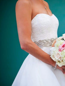 Romana Keveza 'Legends 264' size 2 used wedding dress side view on bride