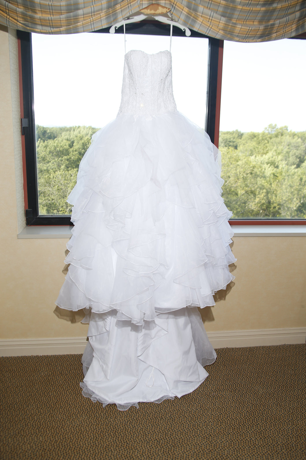 Oleg Cassini 'Strapless Ruffled' size 2 used wedding dress front view on hanger