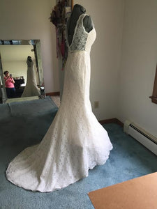 Custom 'Madeline' size 6 used wedding dress side view on mannequin