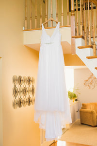 Disney 'Jasmine' size 16 used wedding dress front view on hanger