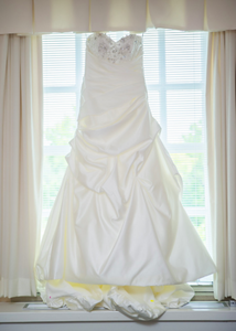 Maggie Sottero 'Parisianna' size 8 used wedding dress front view on hanger