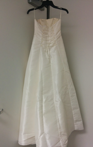 Custom 'Georgette' size 0 new wedding dress back view on hanger