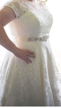 Load image into Gallery viewer, Oleg Cassini &#39;Tea Length&#39; size 16 used wedding dress side view on bride
